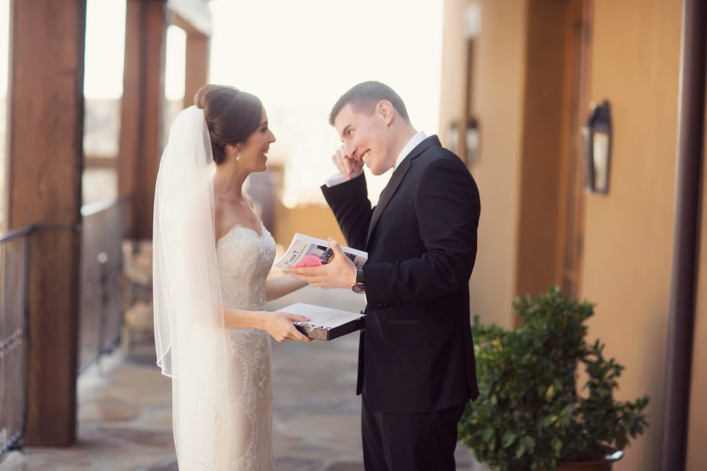 Bride shares the book of her story with groom
