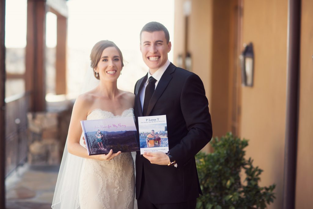 A couple holding during their wedding day holding the book of their story 