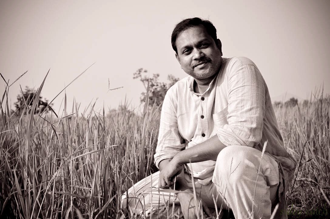 Sidhartha in a field in India 