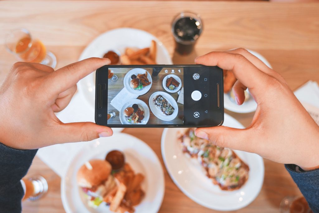 person taking a picture for their Instagram story 